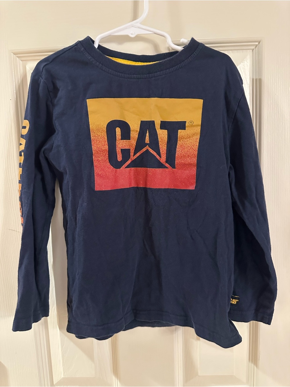 Caterpillar Navy Long Sleeve Tee with Yellow & Red Gradient Logo